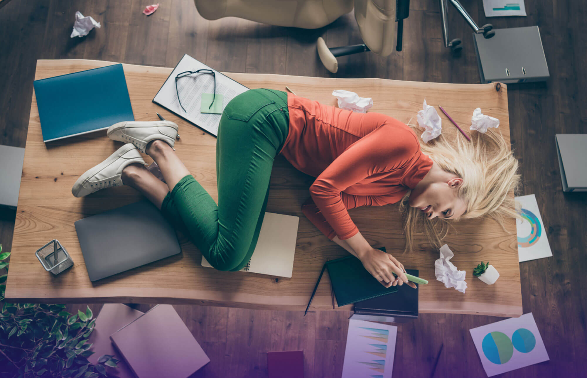 women in clutter, scrolling on her phone - image